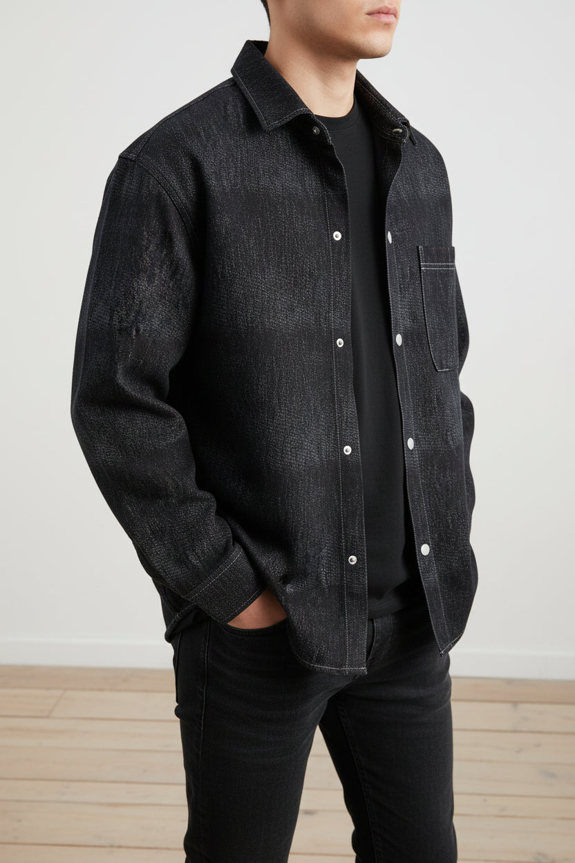 Black denim shirt on a wooden floor
